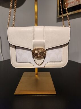 Coach Georgie Crossbody bag in chalk white leather with a gold strap